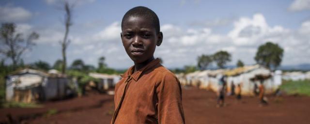 A young refugee from Burundi stands in the Nyarugusu refugee camp in Tanzania on March 26, 2016. According to UNHCR, Nyarugusu is “one of the largest and most overcrowded refugee camps in the world”, currently hosting over 140,000 refugees. A young refugee from Burundi stands in the Nyarugusu refugee camp in Tanzania on March 26, 2016. According to UNHCR, Nyarugusu is “one of the largest and most overcrowded refugee camps in the world”, currently hosting over 140,000 refugees.