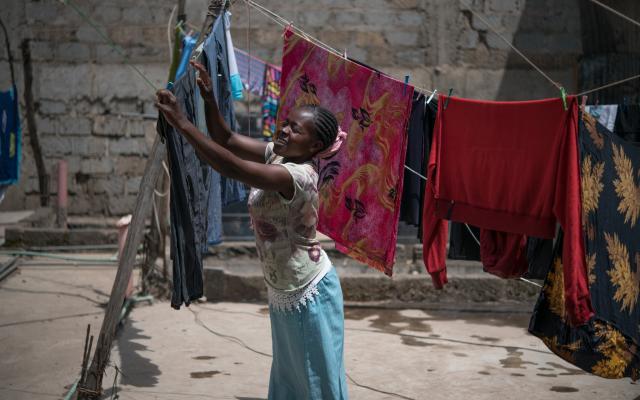 Tabitha Mwikali, 36, a domestic worker hanging clothes for her employer in Eastleigh, Nairobi, Kenya. Credit: Allan Gichigi/Oxfam Tabitha Mwikali, 36, a domestic worker hanging clothes for her employer in Eastleigh, Nairobi, Kenya. Credit: Allan Gichigi/Oxfam