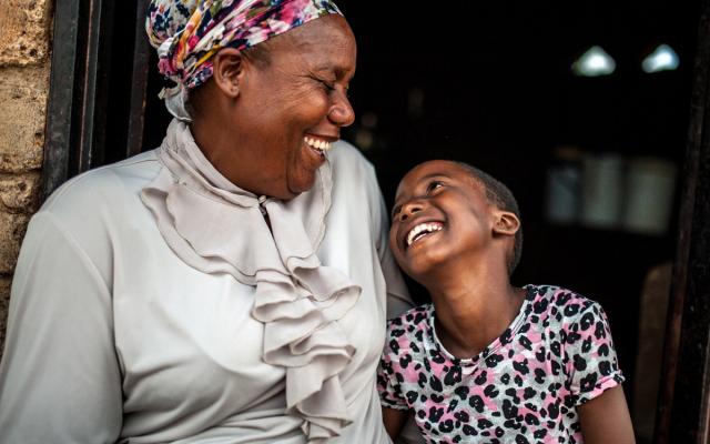 Paulina Sibanda sits with her daughter Tafara* (9) outside their home in Zvishevane region, Zimbabwe. Credit:Aurelie Marrier d'Unienville/Oxfam Paulina Sibanda sits with her daughter Tafara* (9) outside their home in Zvishevane region, Zimbabwe. Credit:Aurelie Marrier d'Unienville/Oxfam