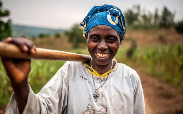 Valerie Mukangerero walks to her pineapple farm in Rwamurema village, eastern Rwanda. Credit: Aurelie Marrier d'Unienville/Oxfam Valerie Mukangerero walks to her pineapple farm in Rwamurema village, eastern Rwanda. Credit: Aurelie Marrier d'Unienville/Oxfam