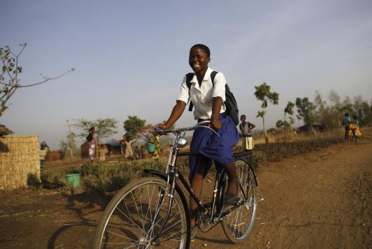 Grace* is one of 30 girls in southern Malawi who received bikes to help them get to school and remain in education. Before receiving her bike from Oxfam, it took her more than two hours to walk the 15km-journey to school. Credit: Corinna Kern/Oxfam Grace* is one of 30 girls in southern Malawi who received bikes to help them get to school and remain in education. Before receiving her bike from Oxfam, it took her more than two hours to walk the 15km-journey to school. Credit: Corinna Kern/Oxfam