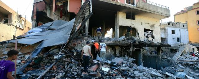 Lebanese people search for their belongings in a damaged building after Israeli strikes on South Lebanon on 23 September, in the village of Al Aqbieh near Sidon, South Lebanon. Lebanese people search for their belongings in a damaged building after Israeli strikes on South Lebanon on 23 September, in the village of Al Aqbieh near Sidon, South Lebanon.