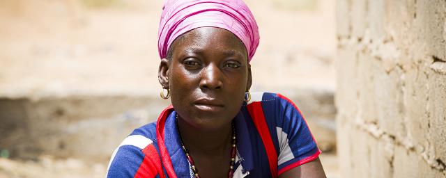 Zoré Fatimata in front of her house, in Burkina Faso.
